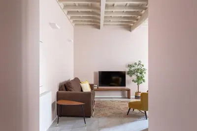 a living room with a couch and a tv at iFlat The Monti Experience in Rome