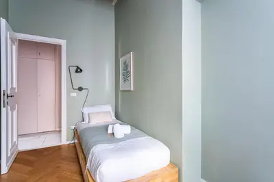a small bedroom with a bed in a room at iFlat The Monti Experience in Rome