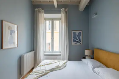 a bedroom with a bed and a window at iFlat The Monti Experience in Rome
