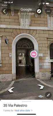 an entrance to a building with a sign on it at Life is Roma Termini in Rome