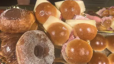 a bunch of donuts sitting on top of a tray at Glint House Roma Sapienza in Rome
