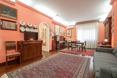a living room with a couch and a table at La Terrazza di Paola San Giovanni in Rome