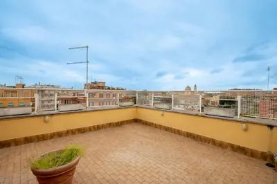 a balcony with a view of the city at La Terrazza di Paola San Giovanni in Rome