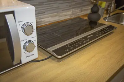 a toaster oven sitting on a counter next to a microwave at Farnese House in Rome
