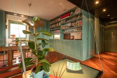 a room with a glass table and a plant at Tiffany's apartment Flaminio in Rome