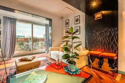 a living room with a couch and a glass table at Tiffany's apartment Flaminio in Rome