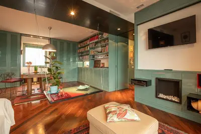 a living room with a couch and a fireplace at Tiffany's apartment Flaminio in Rome