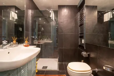 a bathroom with a sink and a toilet and a shower at Tiffany's apartment Flaminio in Rome