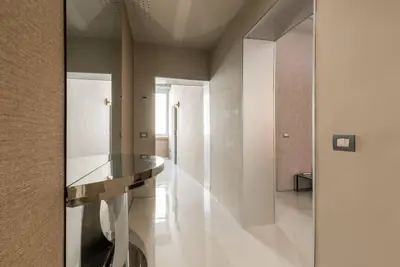 a hallway with a glass table in a room at My Trastevere Suite in Rome