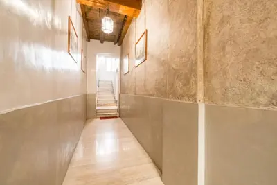an empty hallway with a staircase in a building at My Trastevere Suite in Rome