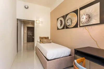 a bedroom with a bed and a desk in it at My Trastevere Suite in Rome