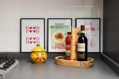 a tray with bottles of wine on a kitchen counter at Trastevere Boutique Apartment in Rome