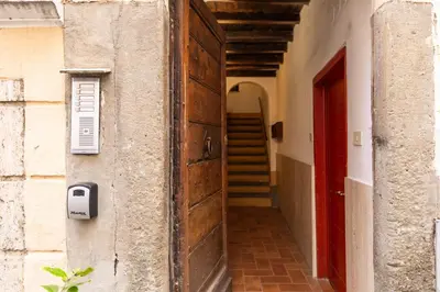 an entrance to a building with a wooden door at Trastevere Boutique Apartment in Rome