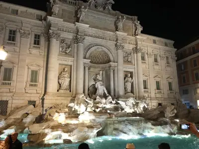 a view of the trevi fountain at night at Guest House VATICAN MUSEUMS PARVA DOMUS in Rome
