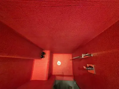 a bathroom with red walls and a red ceiling at Attico Cavour Prati, vicino Piazza Navona, Castel Sant'Angelo e San Pietro in Rome