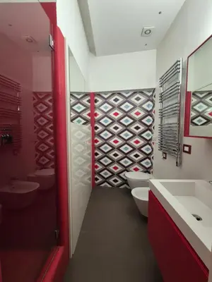 a bathroom with two sinks and two toilets and a wine cellar at Attico Cavour Prati, vicino Piazza Navona, Castel Sant'Angelo e San Pietro in Rome