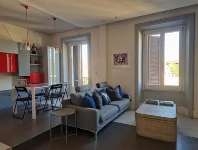 a living room with a couch and a table at Attico Cavour Prati, vicino Piazza Navona, Castel Sant'Angelo e San Pietro in Rome