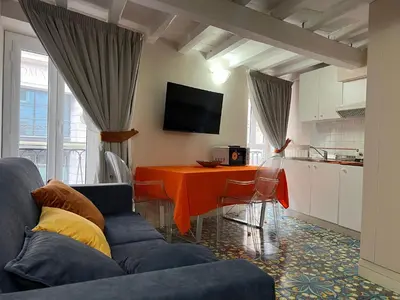 a living room with a couch and a table at Artemide Domus Romae in Rome