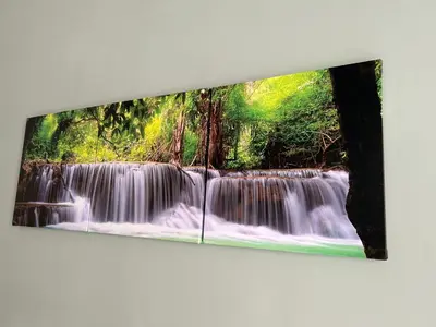 a painting of a waterfall hanging on a wall at Dielle Apartments ROMA in Rome