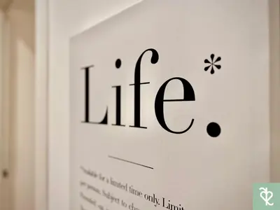 a white wall with the word life written in black at RomeSweetRome in Rome