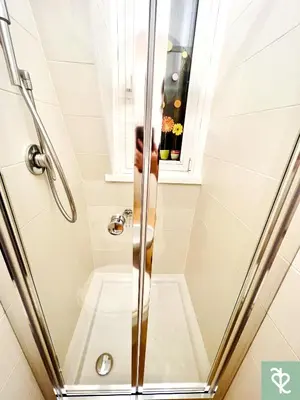 a shower with a glass door in a bathroom at RomeSweetRome in Rome