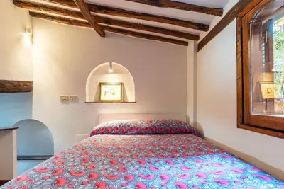 a bedroom with a bed and a window at Trastevere Escape - Charme Holidays in Rome