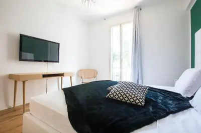 a bedroom with a bed with a black blanket at My Trastevere Three Bedroom View Apartment in Rome