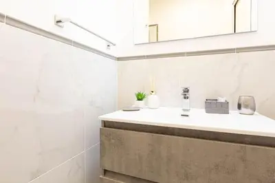 a bathroom with a sink and a mirror at Trastevere Silver King Jacuzzi Suite in Rome