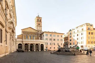 a large building with a clock tower on top of it at Romantic Jacuzzi Suite Trastevere in Rome