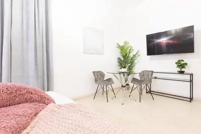 a bedroom with a bed and a table and chairs at Romantic Jacuzzi Suite Trastevere in Rome