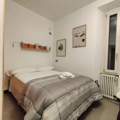 a bedroom with a bed and a window at Appartamento Musei Vaticani in Rome