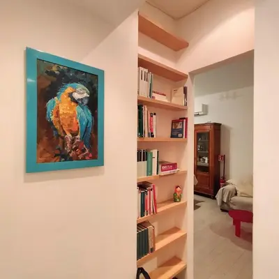 a painting of a parrot hanging on a wall at Appartamento Musei Vaticani in Rome