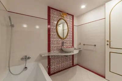 a bathroom with a shower and a sink and a mirror at GuestHost - Palazzo Altieri Elegant Apartment in Rome