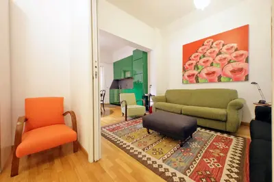a living room with a couch and a chair at Laterano in Rome