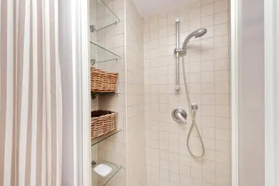 a shower with a shower head and a toilet in a bathroom at Laterano in Rome