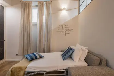 a bed with two pillows on it in a room at La luna nel pozzo a Roma in Rome