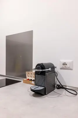 a computer monitor sitting on the floor in a room at Elle Cavour Apartment in Rome