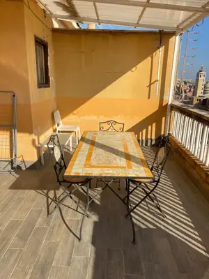 a table and chairs sitting on a balcony at Terrace on the 11th floor in Rome