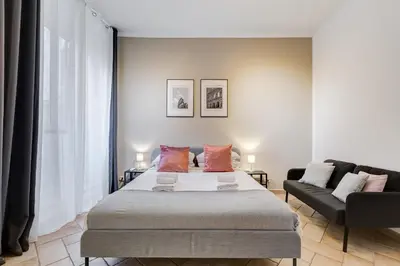 a bedroom with a bed and a couch at Pantheon Boutique Apartment 