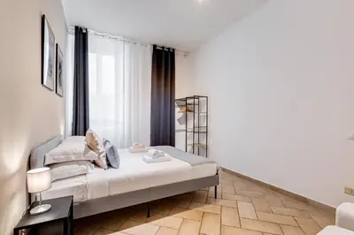 a bedroom with a bed and a window at Pantheon Boutique Apartment 