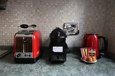a kitchen counter with a toaster and a coffee maker at Pantheon Boutique Apartment 