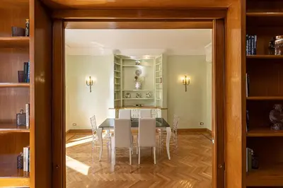 a dining room with a table and chairs at Ludovisi by Rental in Rome in Rome
