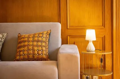 a living room with a couch and a lamp on a table at Ludovisi by Rental in Rome in Rome