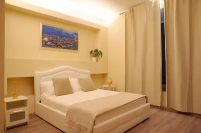 a hallway with chairs and tables in a room at Musa Rooms Roma in Rome