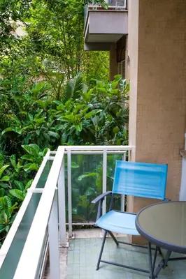 a blue chair and a table on a balcony at Traversari 27 in Rome