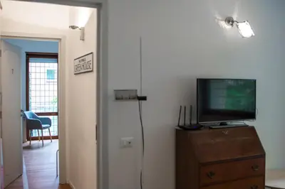 a living room with a tv and a dresser with a television at Traversari 27 in Rome