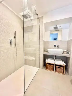 a bathroom with a shower and a sink at TRASTEVERE URBAN SUITE in Rome