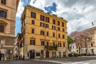 a yellow building on the side of a street at Navona Sky Palace in Rome