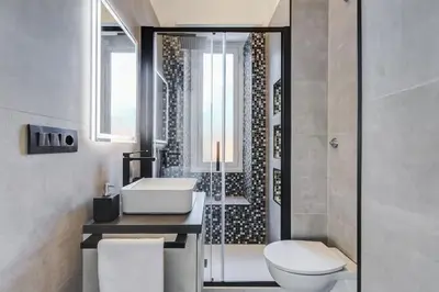a bathroom with a toilet and a sink and a shower at Classy Apartment - Auditorium & Villa Borghese in Rome