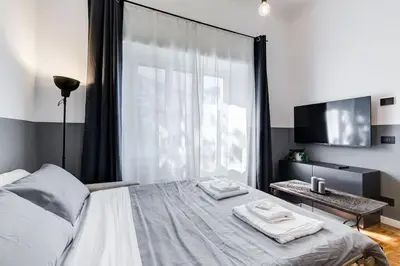 a bedroom with a bed with two towels on it at Classy Apartment - Auditorium & Villa Borghese in Rome